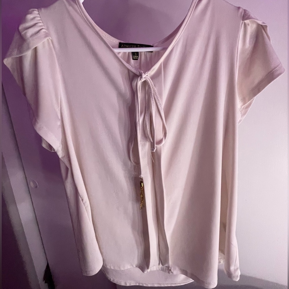 White/cream top with ruffled white sleeves